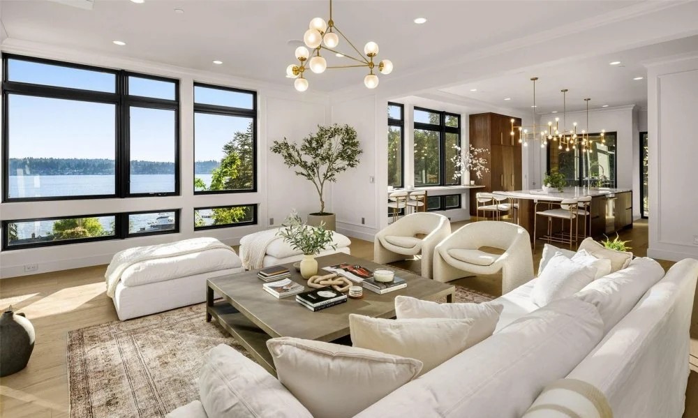 Open-concept great room with lake view and modern furnishings